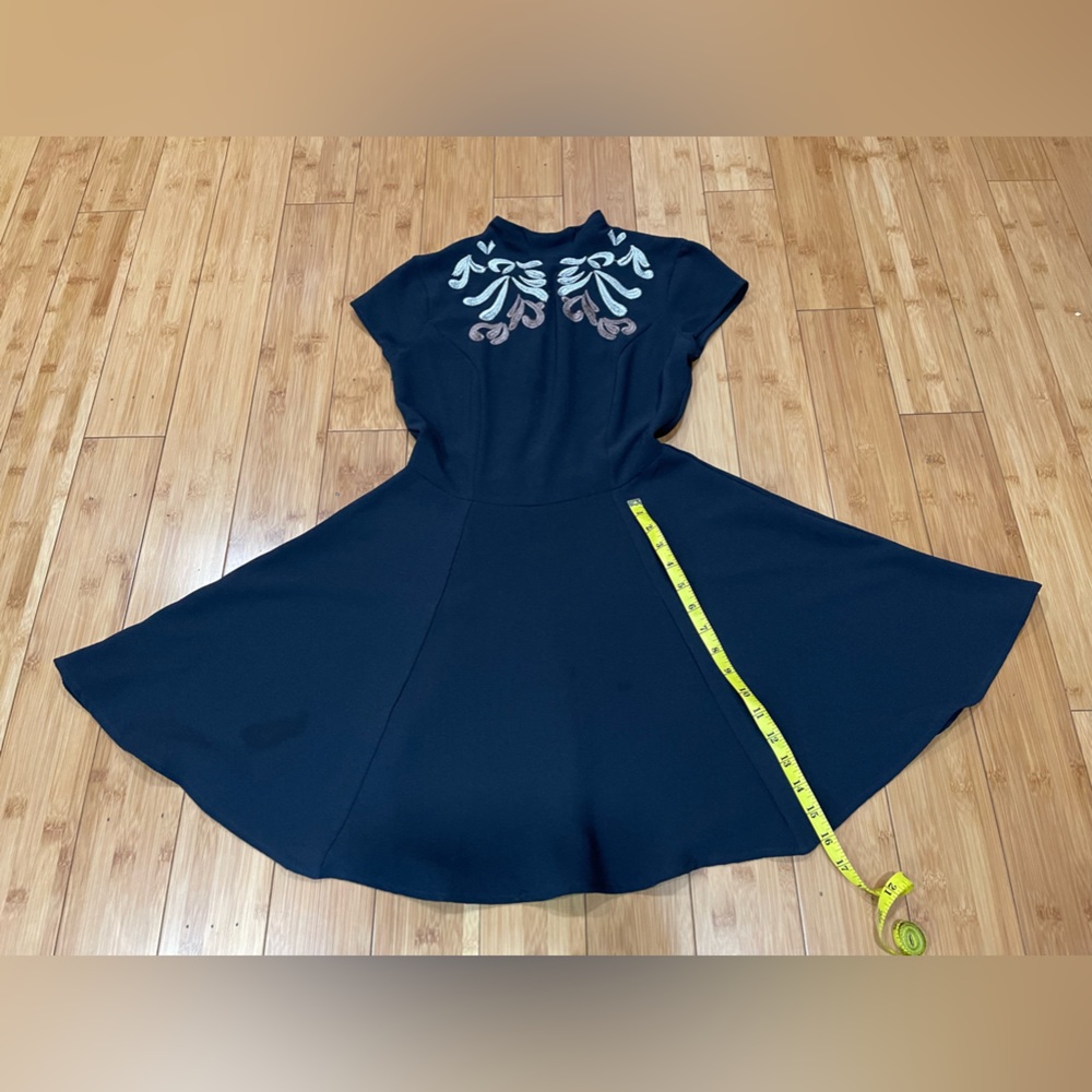 Black dress with brown and gray drawings on the front